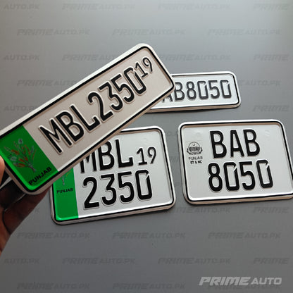 embossed punjab old bike number plate in hand